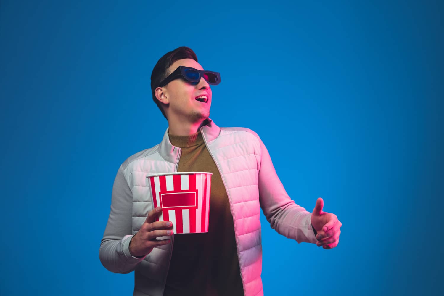 The boy has fun popcorn watching film